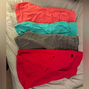 Size XL swim trunks all together, red pair still has tags.